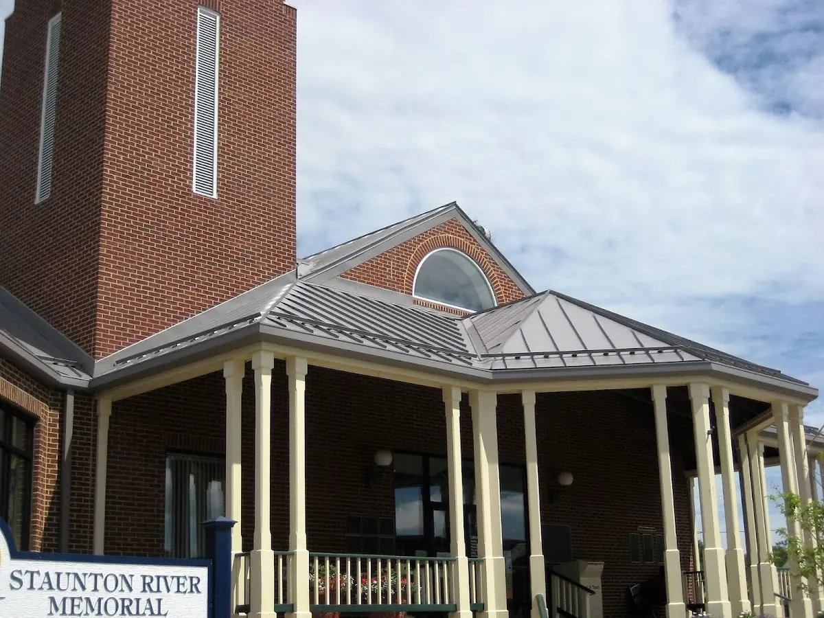 Skilled roofing craftsmen working on a residential roof in North Reading